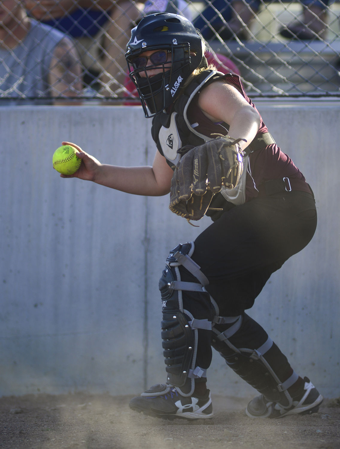 Kodi Boden recovers a past ball and looks to throw out a baserunner
